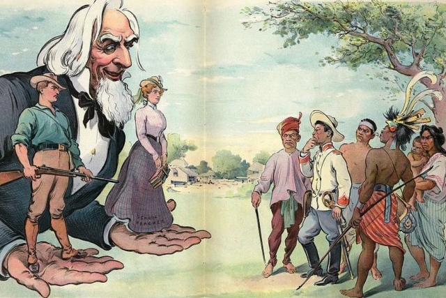Карикатура американского журнала Puck. Иллюстрация показывает, что дядя Сэм предлагает с одной стороны солдата, а с другой — «Учителя школы» группе неохотных филиппинцев, говоря им, что выбор принадлежит им
